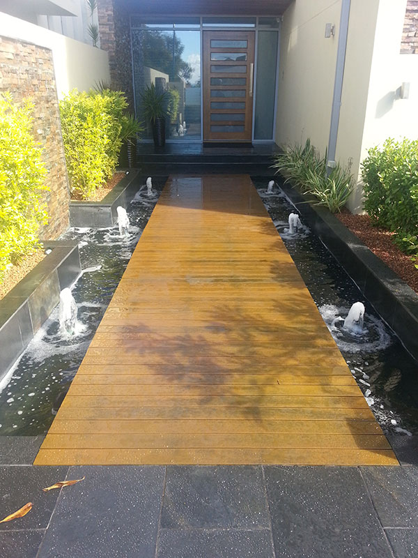 Water feature entry garden with timber walkway